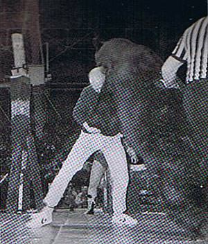 Greg Best tackles the bear.