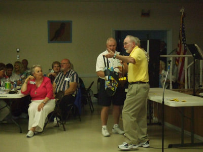 Charlie emcees as Sue watches her hubby in action