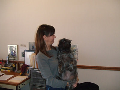 Allie helps her master at work.